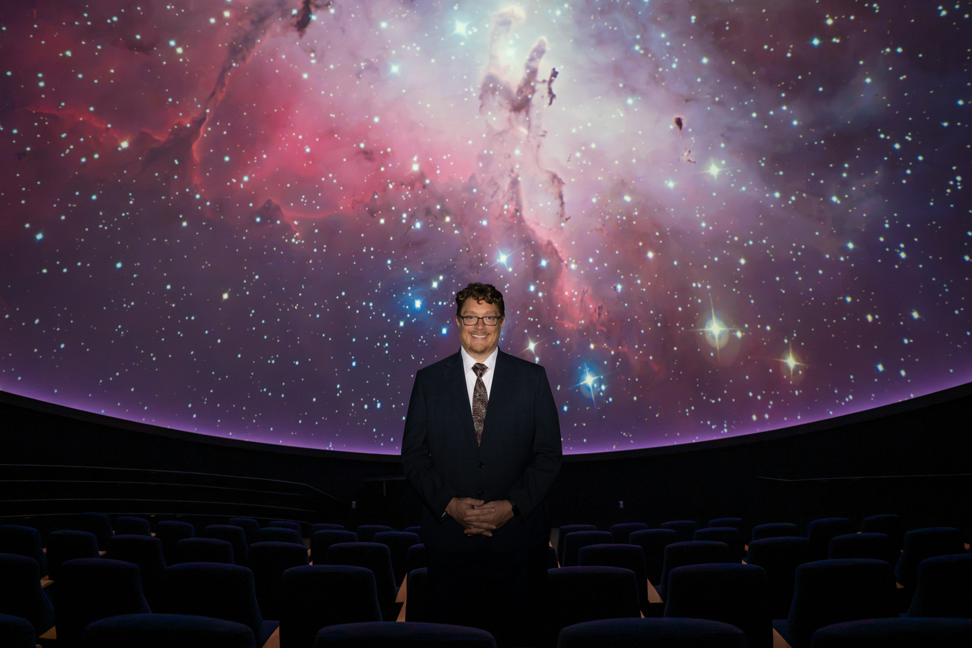 Exploring new horizons. Dr. Shadow JQ Robinson at the FSU Planetarium
